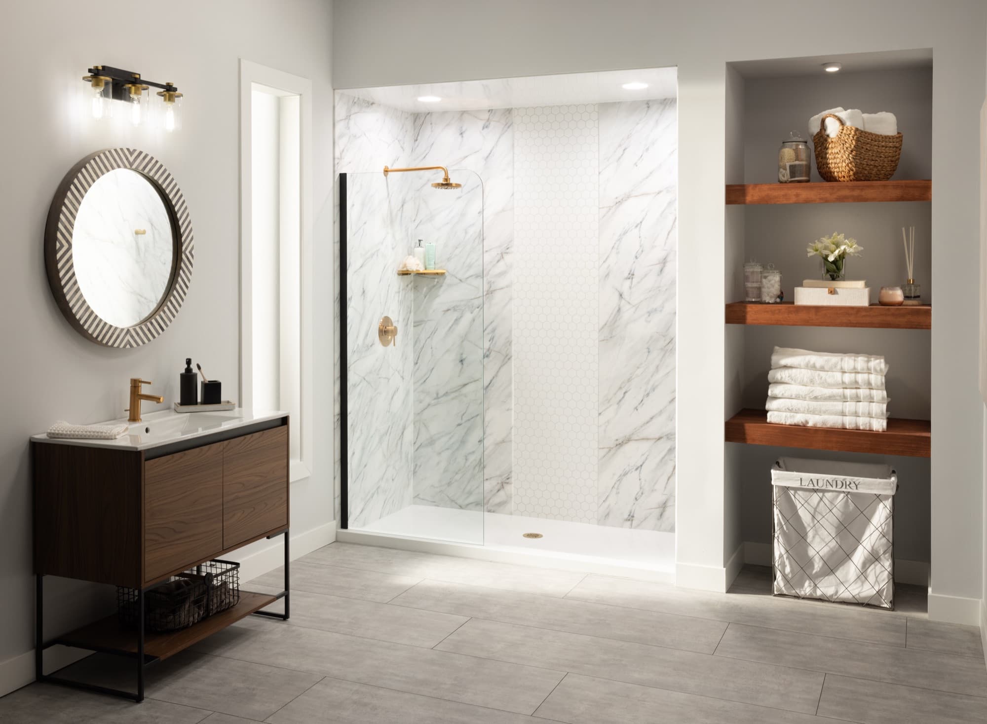 Brushed gold shower hardware against softly veined marble-look wall panels